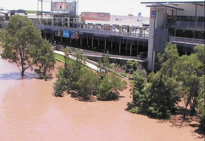 Floodwaters lap the foundations of the Riverlink shopping centre near Ipswich. Photo Glenys Sanders